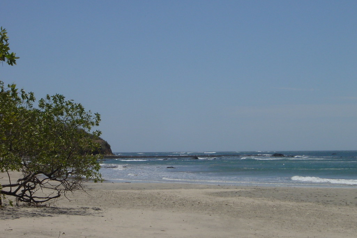 Blue clean and clear water and brown sand on the 