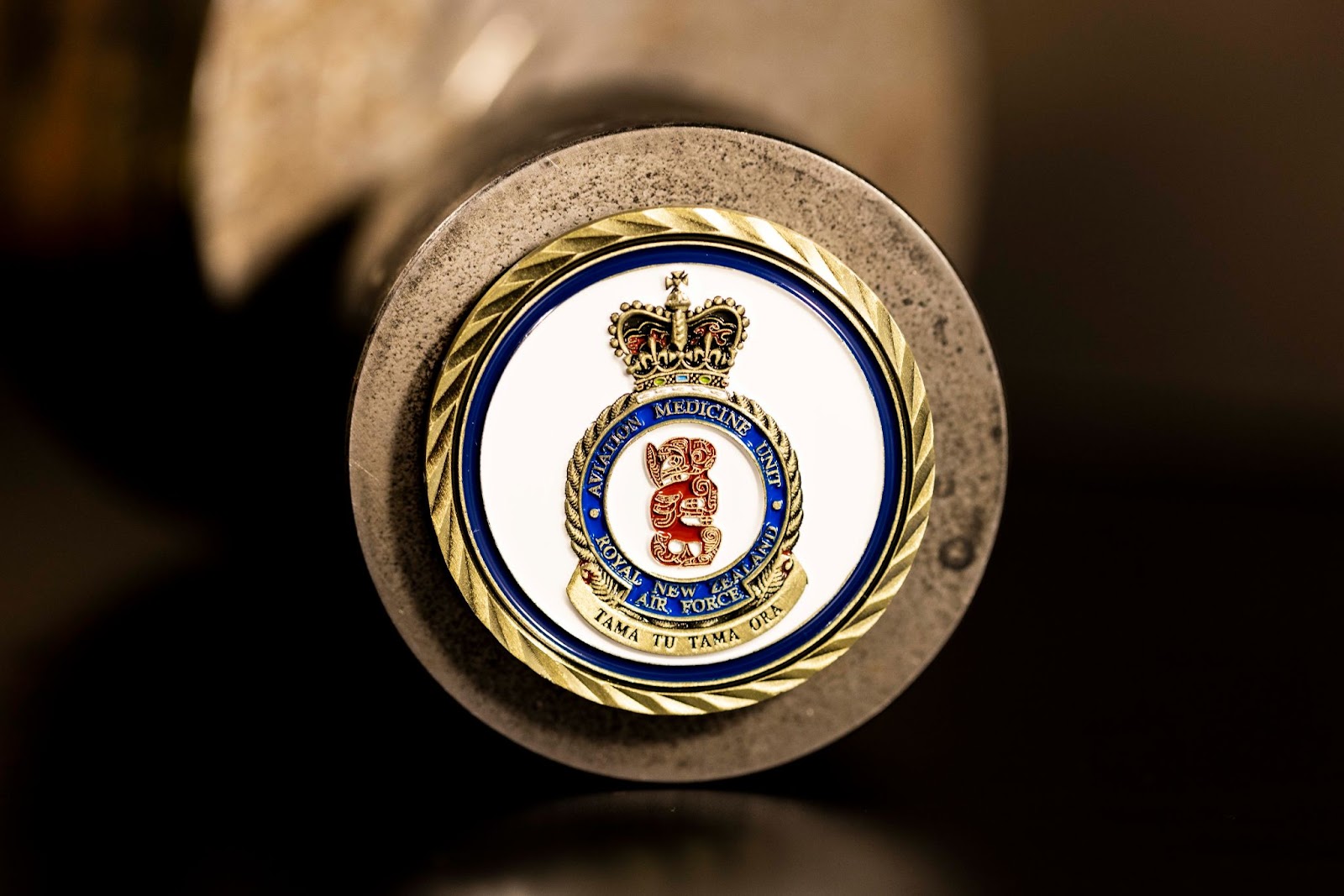 Close-up of an oblique challenge coin edge.