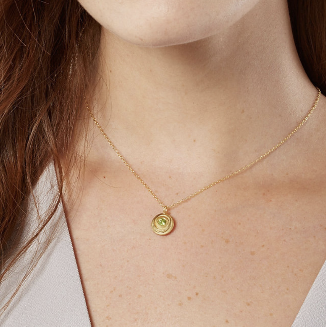 gold peridot swirl necklace