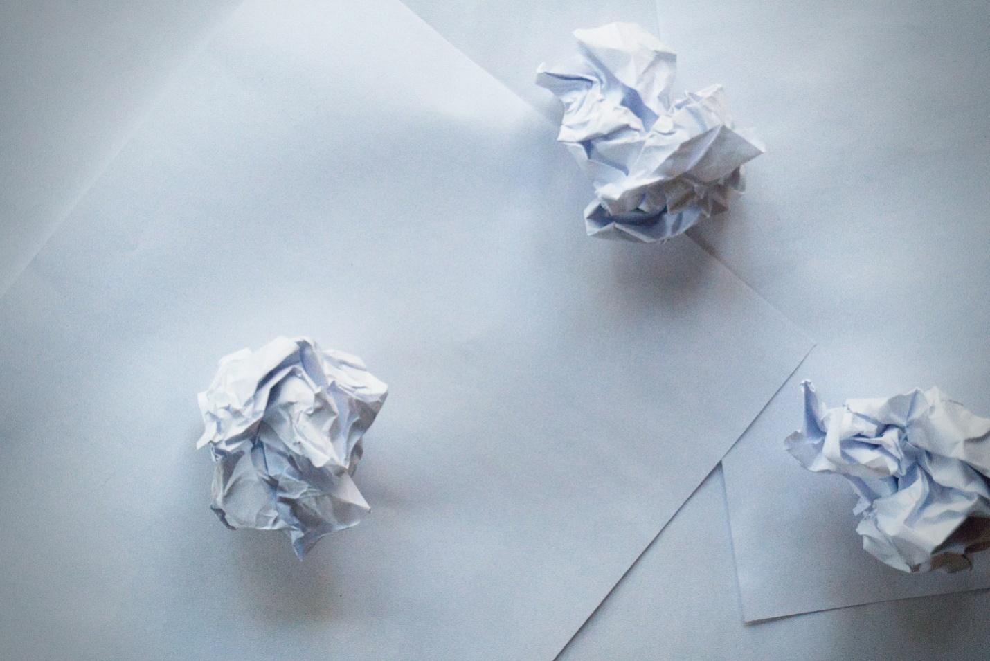 water paper and crumbled-up paper balls