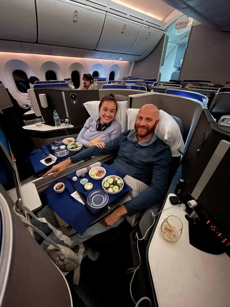 Scott and Maddy sitting in United Polaris business class on their flight to Frankfurt. 