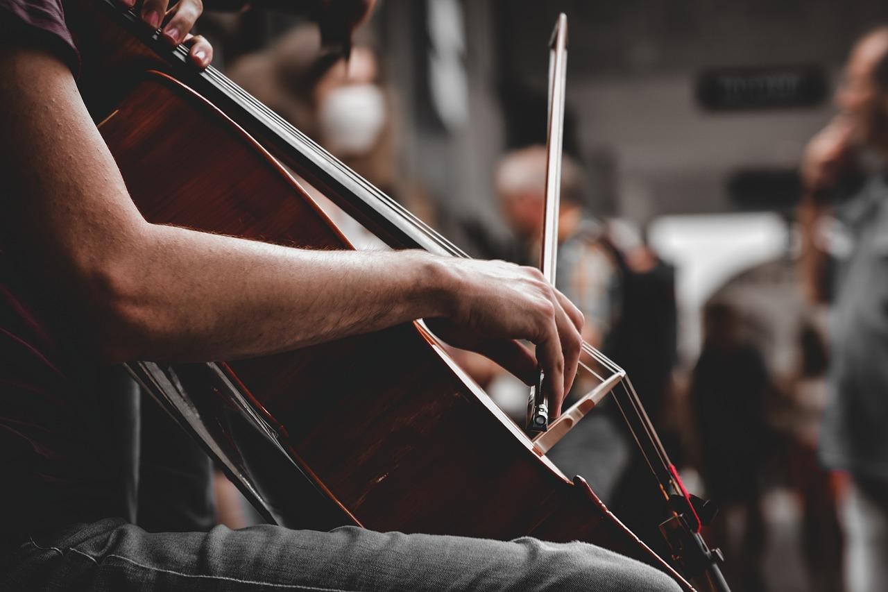 A person playing a cello

Description automatically generated