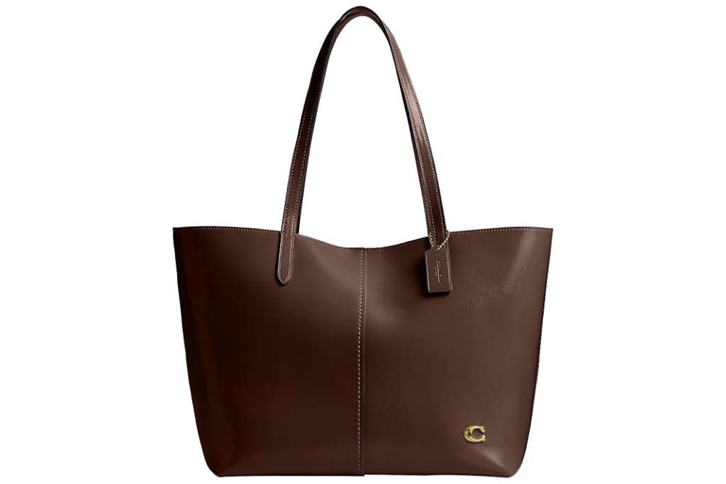 brown leather coach bag with brown handles and a gold c emblem