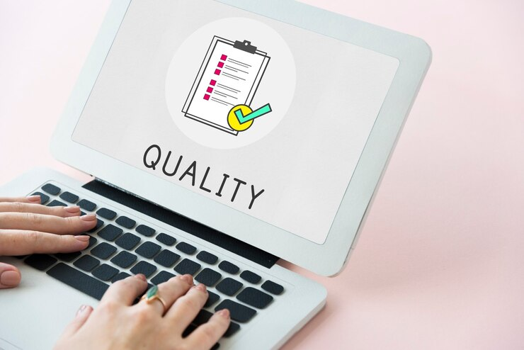 Quality assurance clipboard icon on a laptop screen