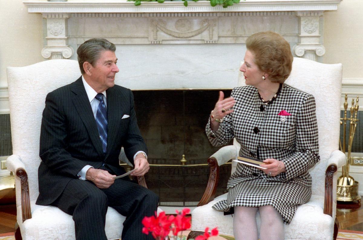 A photograph of Ronald Reagan and Margaret Thatcher sitting together in conversation.