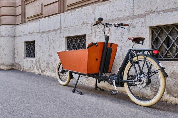 Bicycle parked on street against building