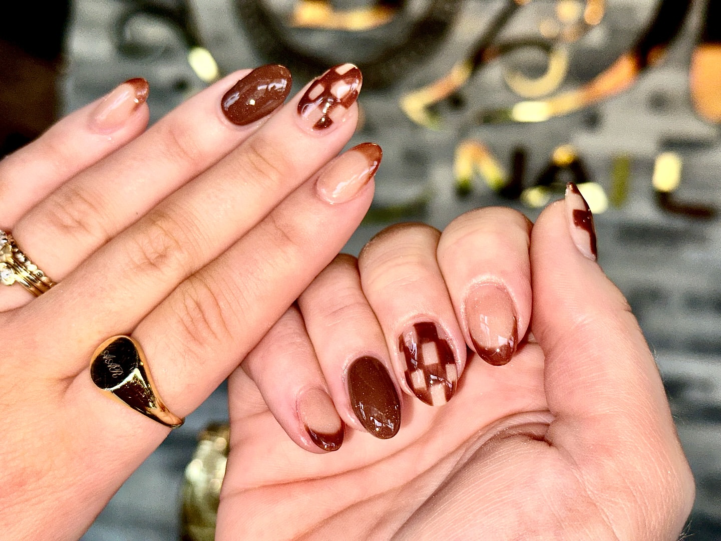 Close-up of hands with fall nail design having Warm Neutrals