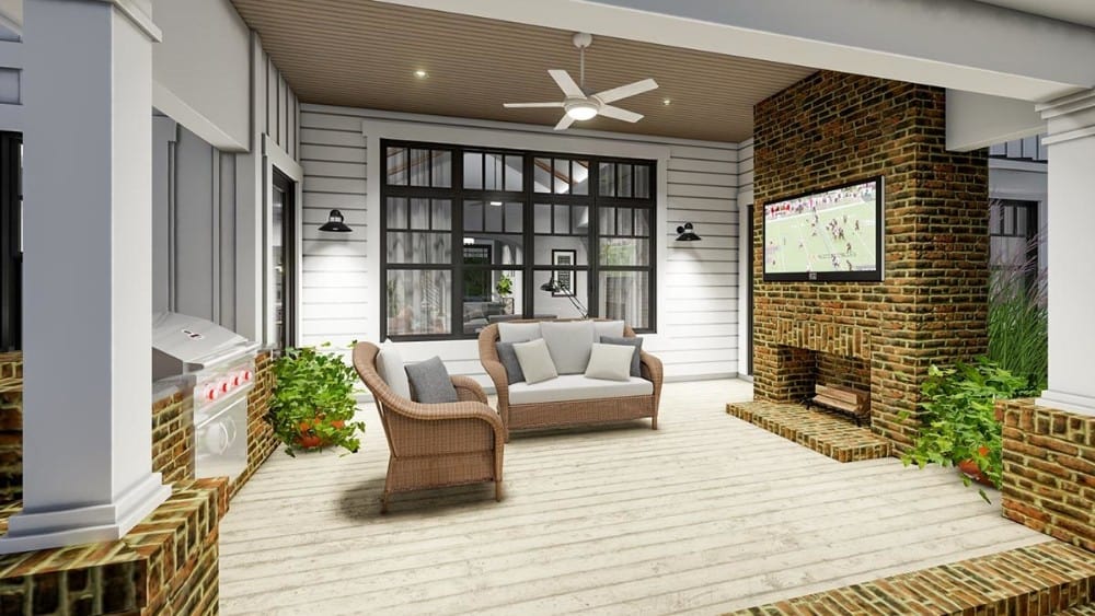 Covered lanai with wicker seats, a bbq grill, and a brick fireplace.