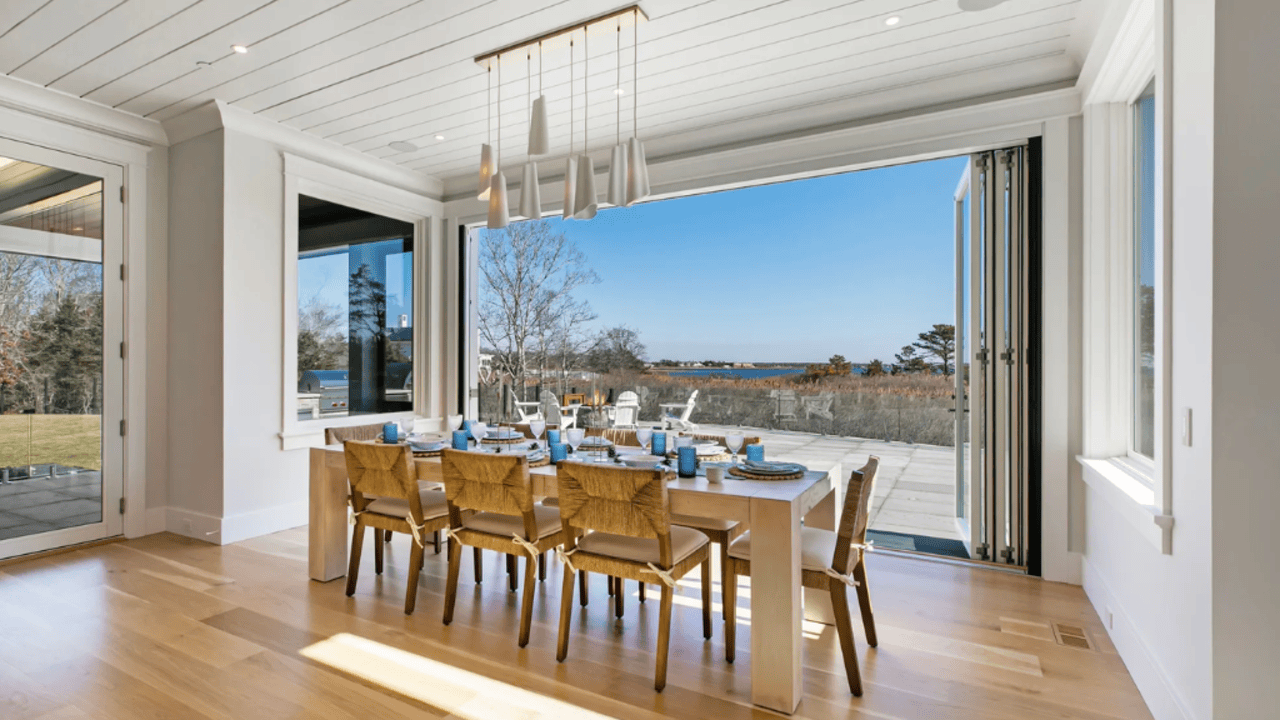Tour This 8,094 Sq Ft Shingle-Style Waterfront Estate in Quogue, NY with Floating Staircase and 300-Bottle Wine Cellar