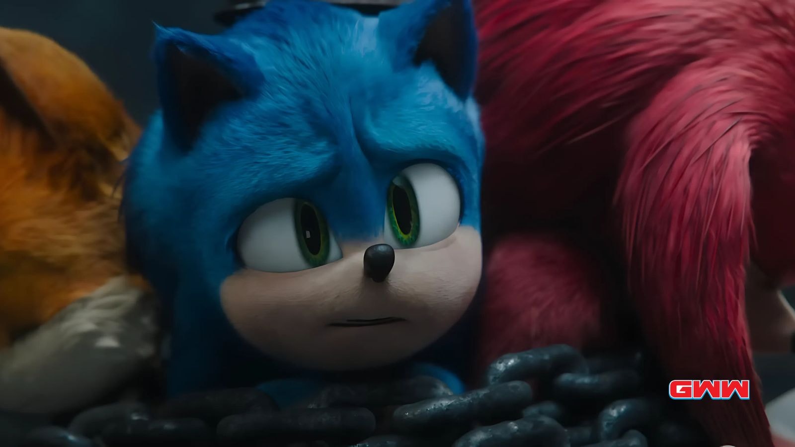 Sonic looks worried, chained alongside Knuckles and Tails in a tense moment.