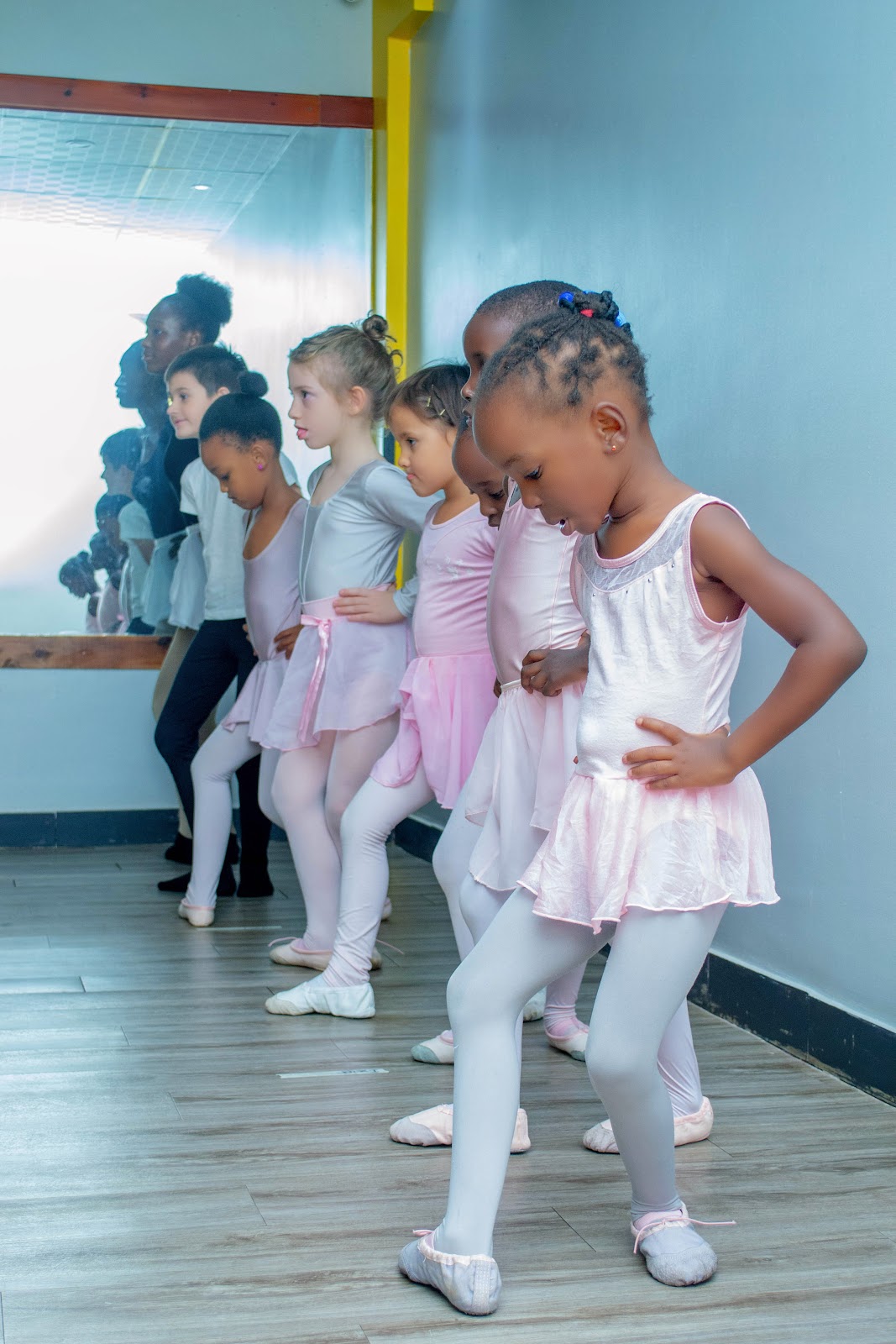 Leotard Ballet dancers making feet movements during class 