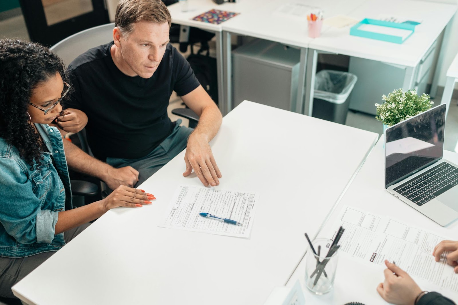 Two parents in a meeting with a teacher