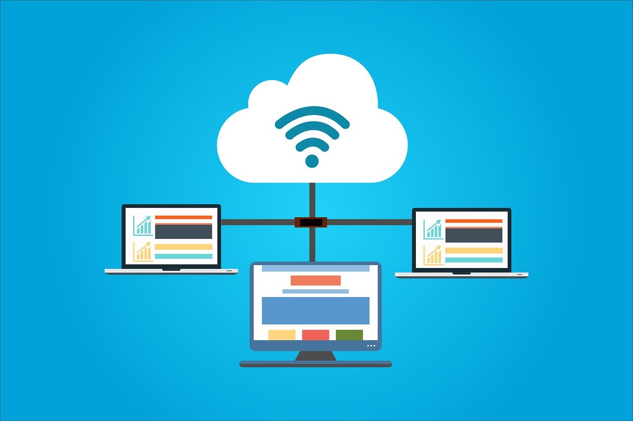 A digital image of a cloud icon with a WiFi signal symbol, connected to three laptops on a blue background.