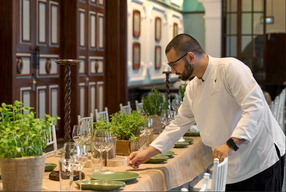 A person standing at a table

AI-generated content may be incorrect.