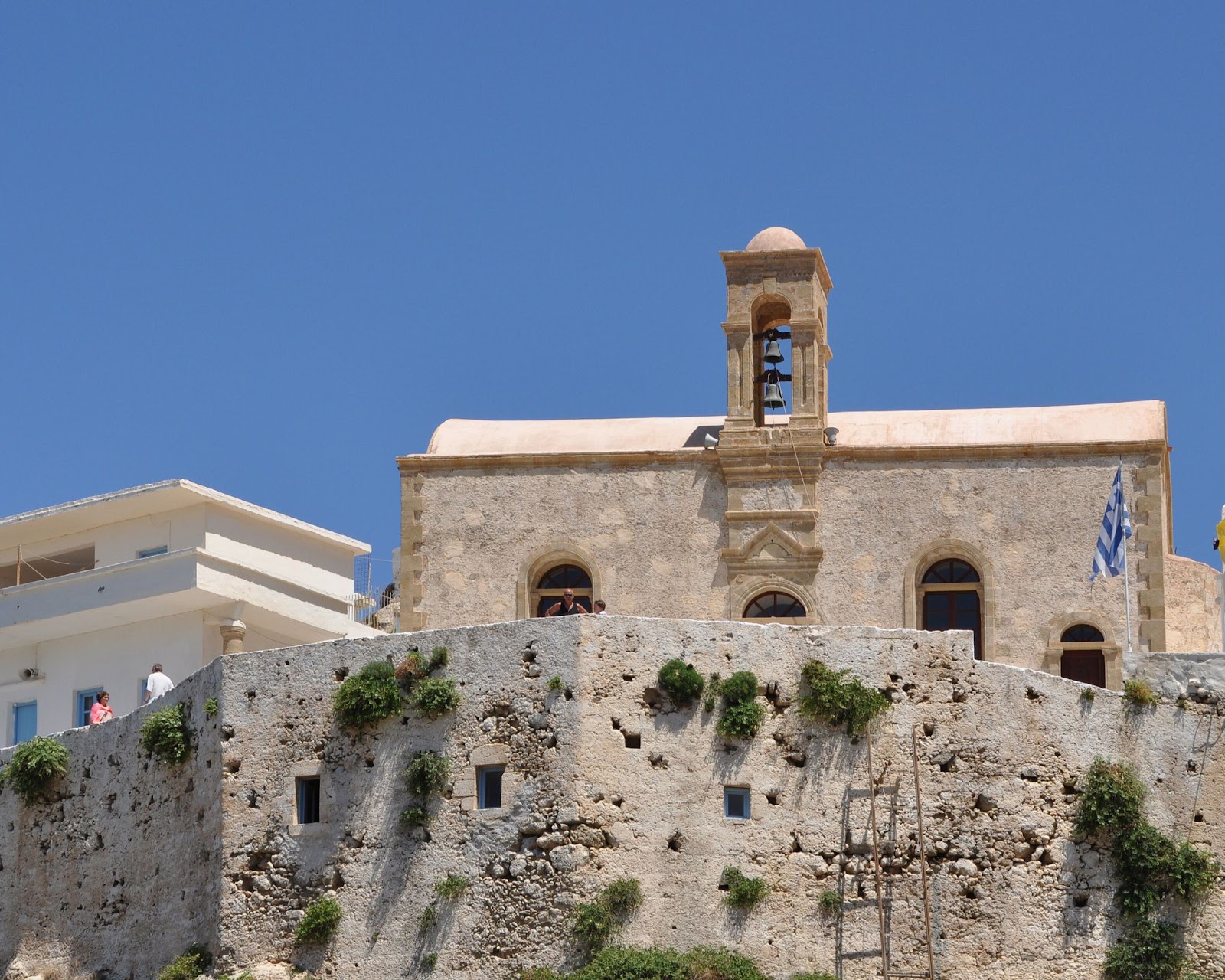 A picture of Chrysoskalitissa Monastery perched on a hill,