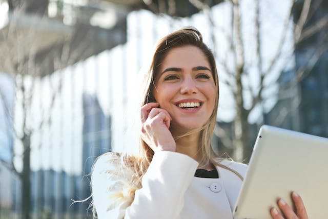  A person on a phone call smiling.