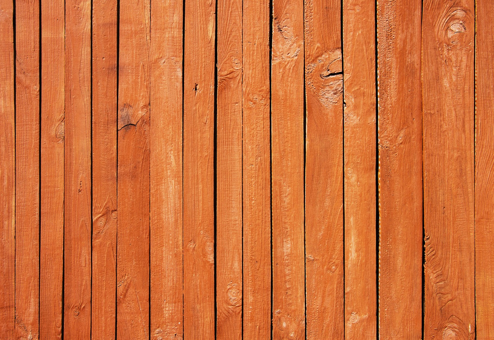 Close up of brown painted wooden fence panels