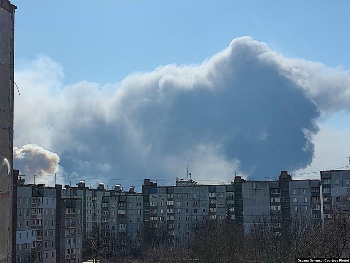 A group of buildings with smoke coming out of them

Description automatically generated