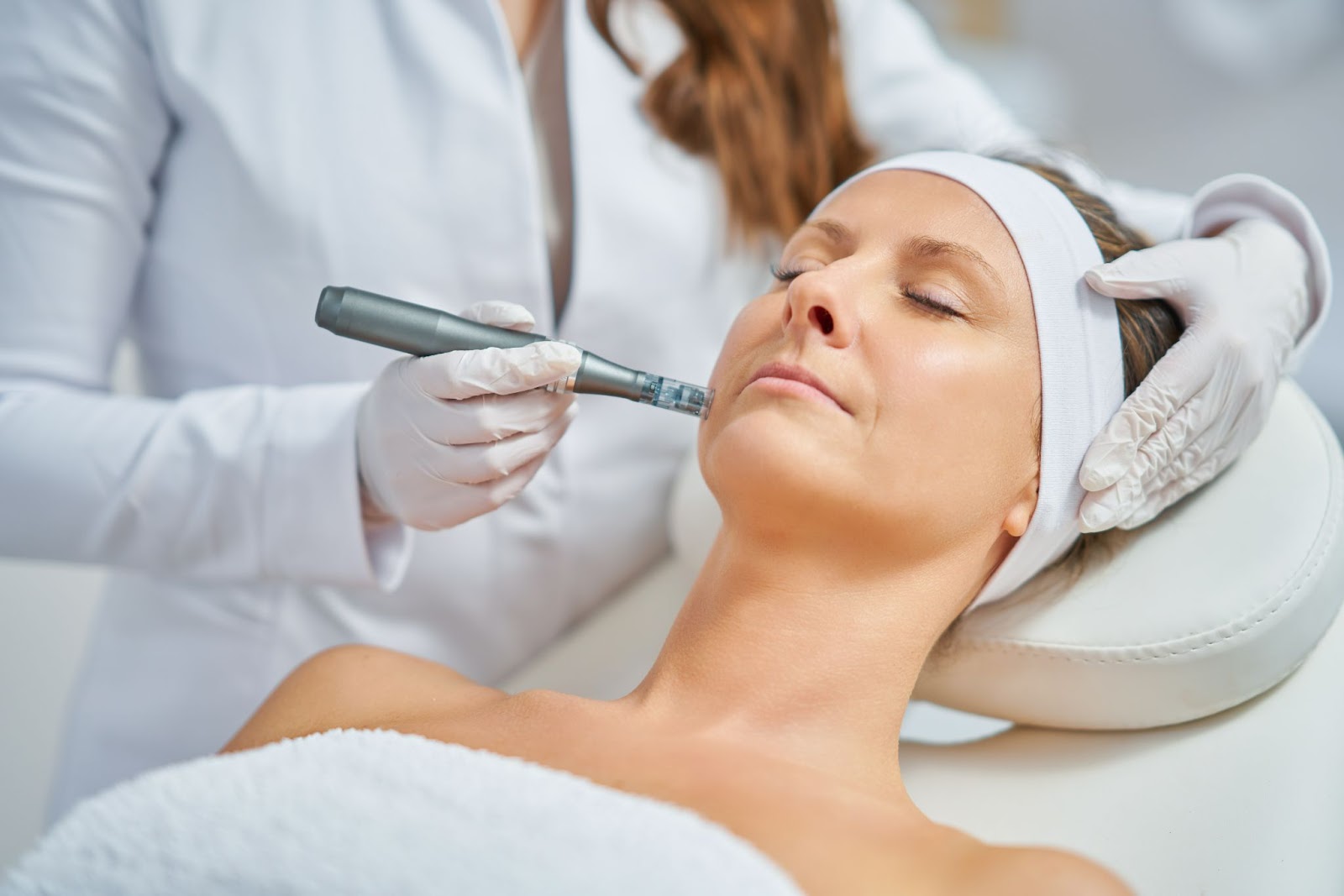 Person receiving a Microneedling aftercare treatment from provider