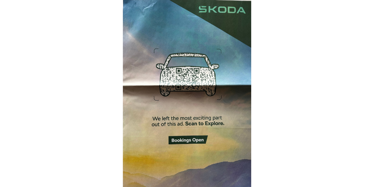 A Skoda branded QR Code on the front page of a newspaper.