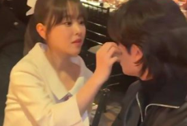 This contains an image of park bo young removing something from park hyung sik face