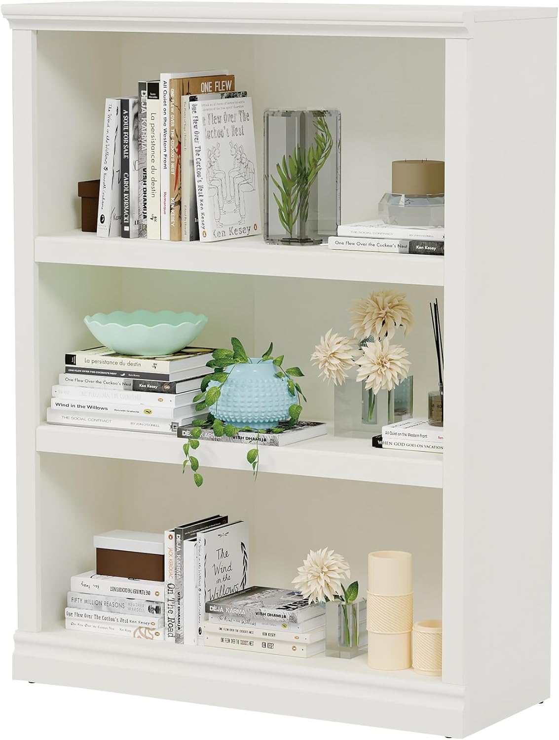 a white shelf with books and vases bookshelves