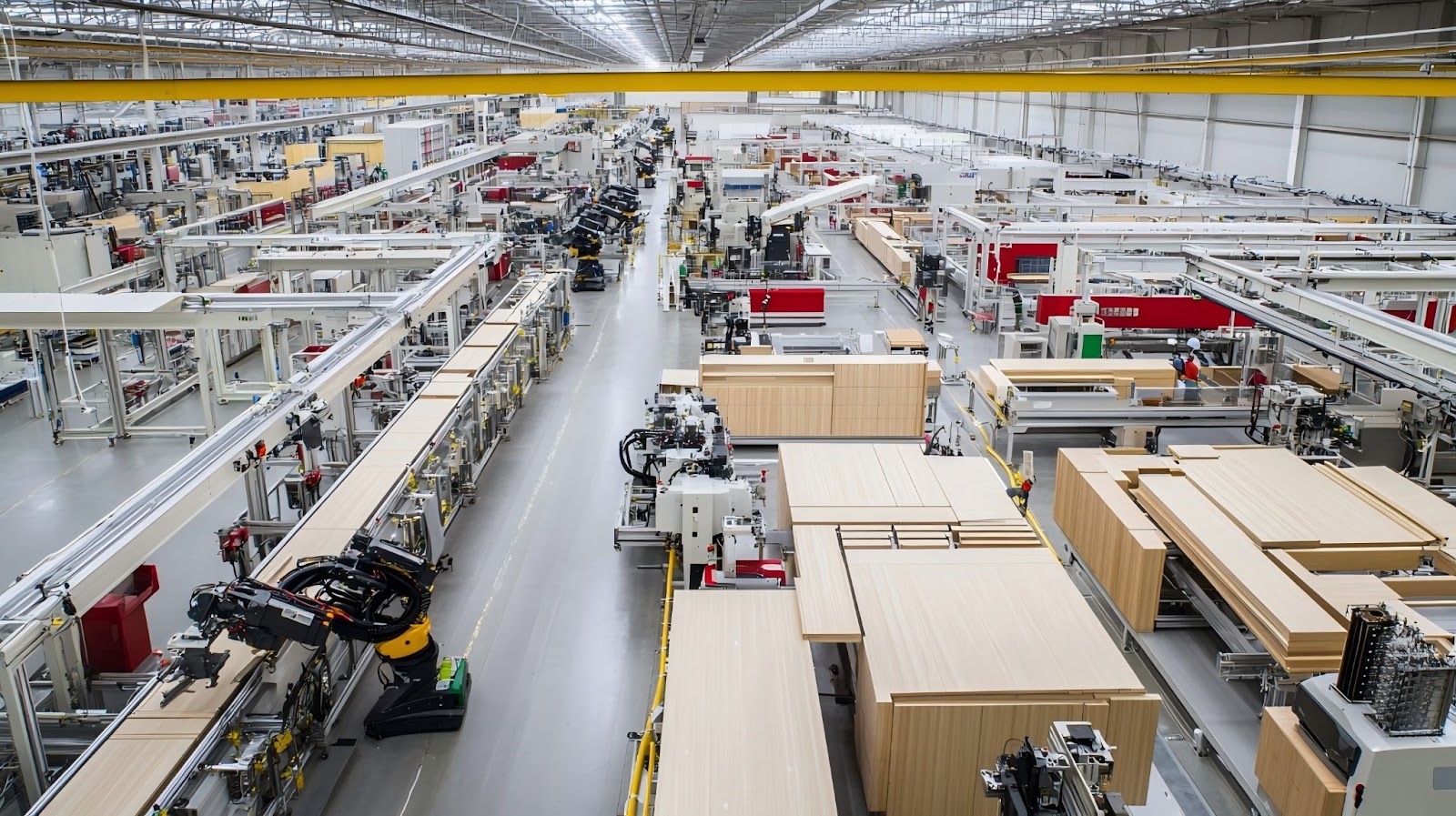 Automated cabinet production line in large-scale factory with CNC machinery and robotic systems assembling wood components.