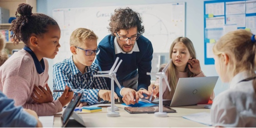Screenshot of students sitting in a classroom. Image via Alludo