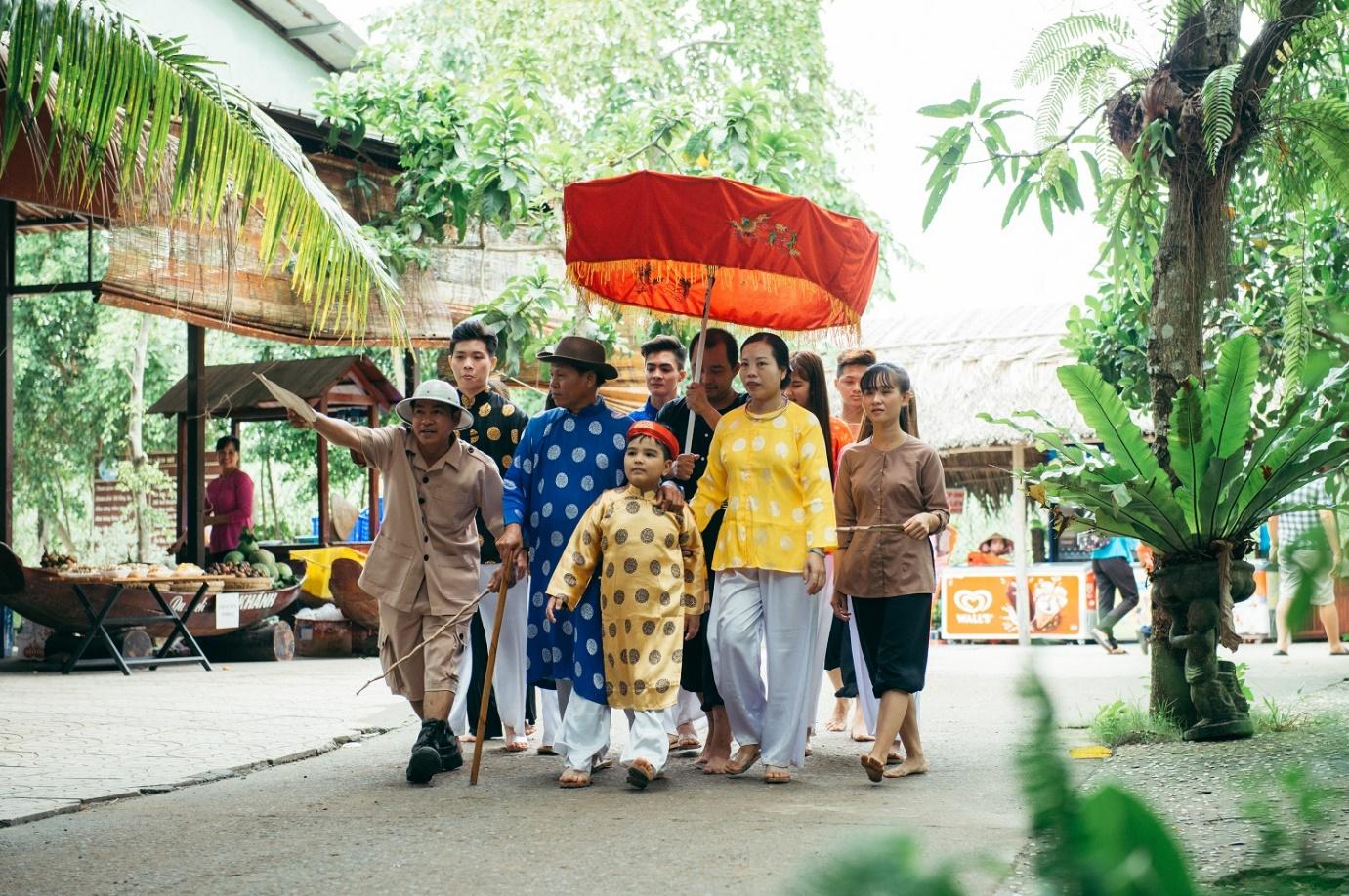 A group of people walking down a streetDescription automatically generated