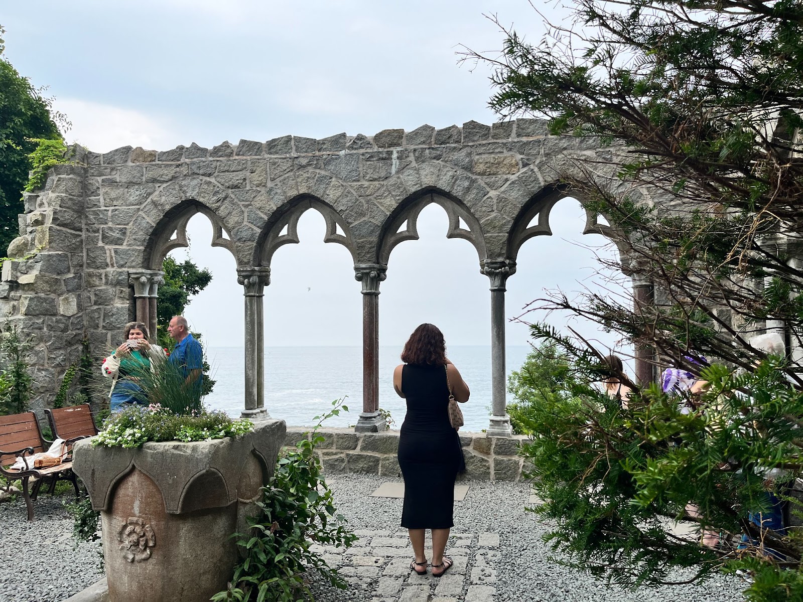 People enjoying the view of the Atlantic Ocean at Hammond Castle Museum in Gloucester, Massachusetts