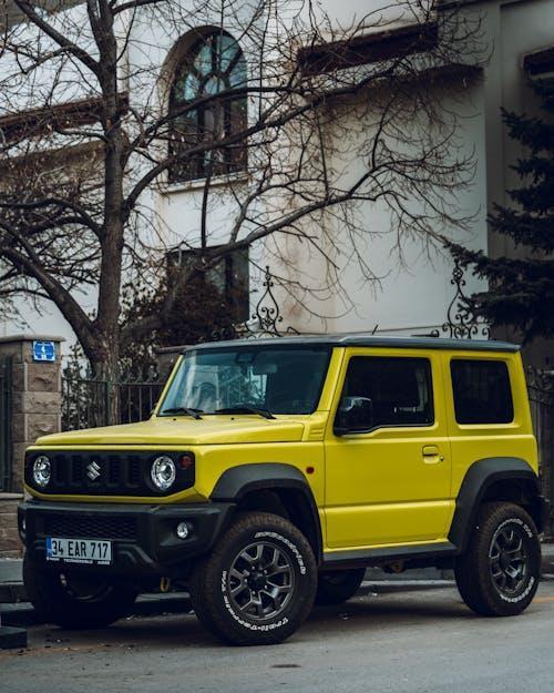 Free Yellow Suzuki Jimny Parked on the Street Stock Photo