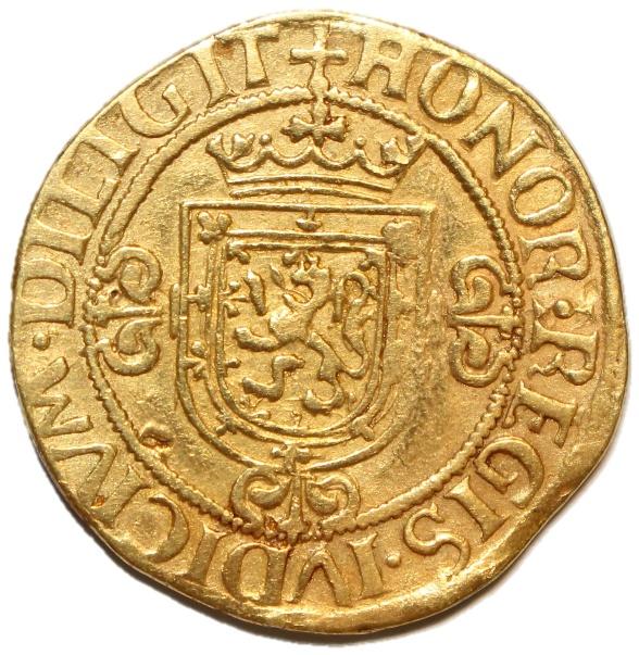 A gold coin with a lion and crown

Description automatically generated