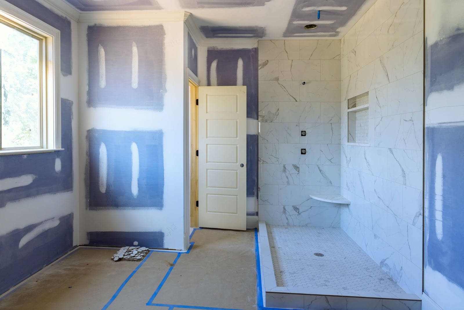 A home bathroom undergoing remodeling. 