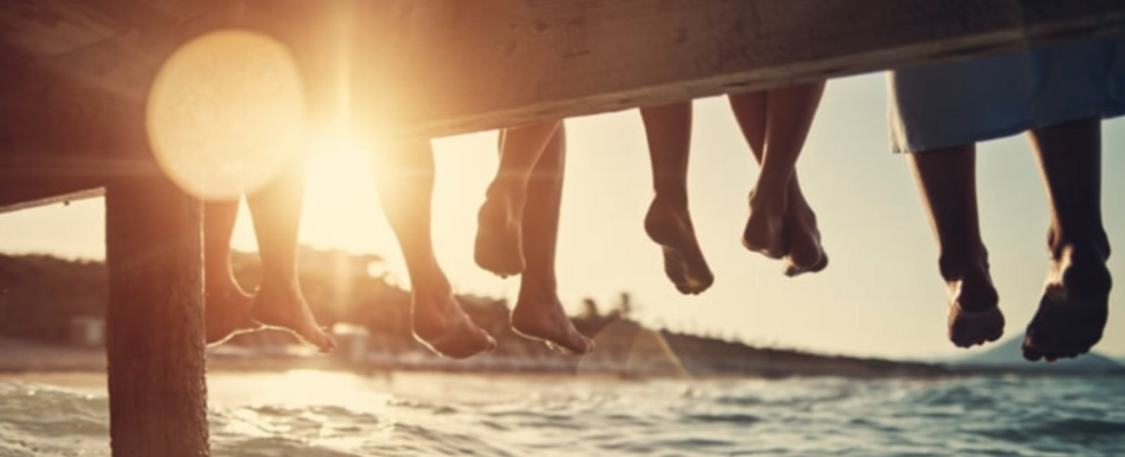 Image of people sitting on a dock