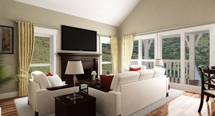 Living room with white seats, large windows, and a fireplace fitted under the wall-mounted TV.