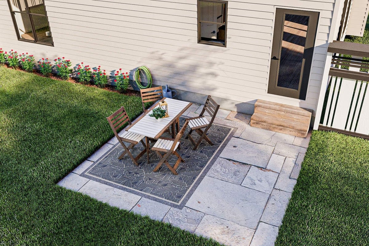 Rear patio with outdoor dining set over a tiled flooring.