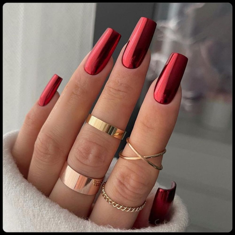 Close up of hands having Christmas red nails with Metallic Red Sleigh Vibes