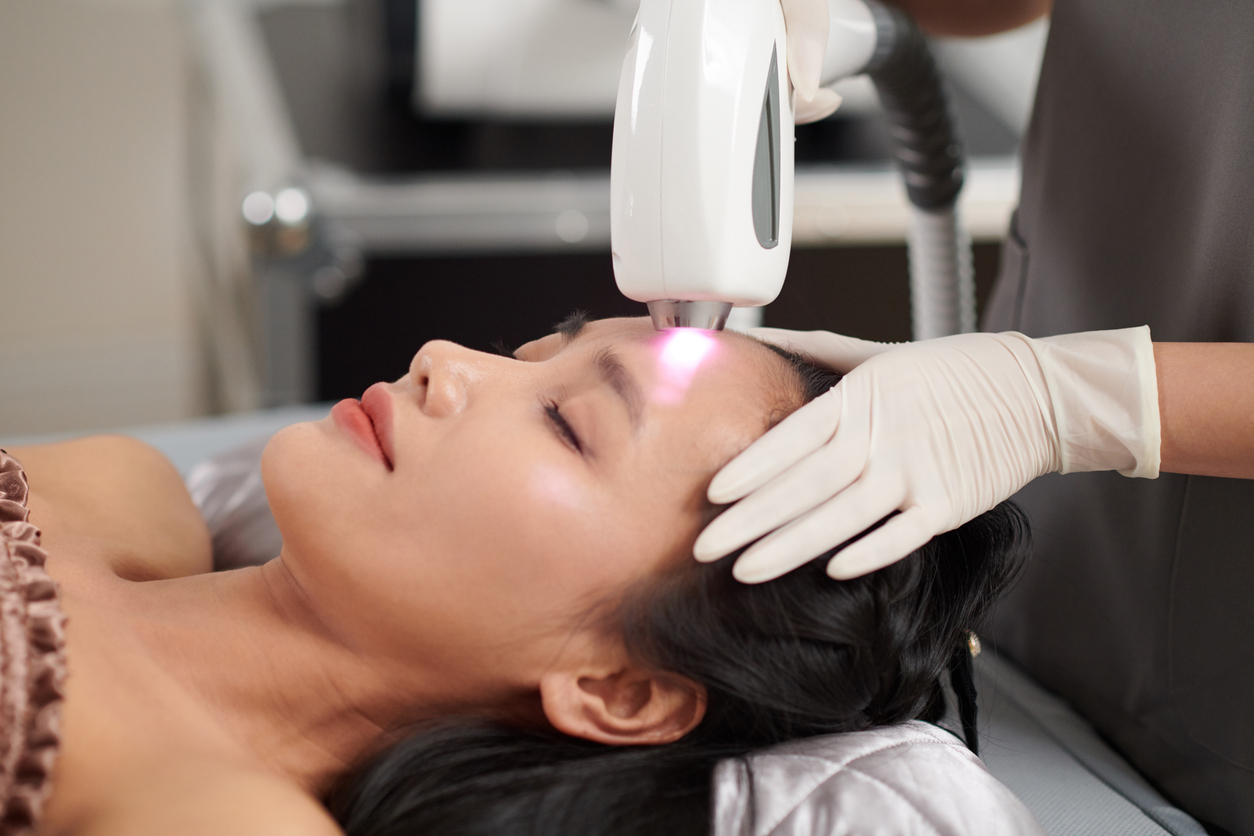 in this image the lady is getting the laser skin treatment 