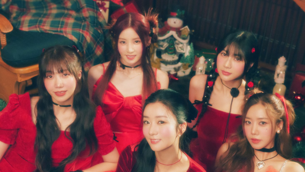 APINK wearing red surrounded by holiday decor for their kpop christmas song pink christmas