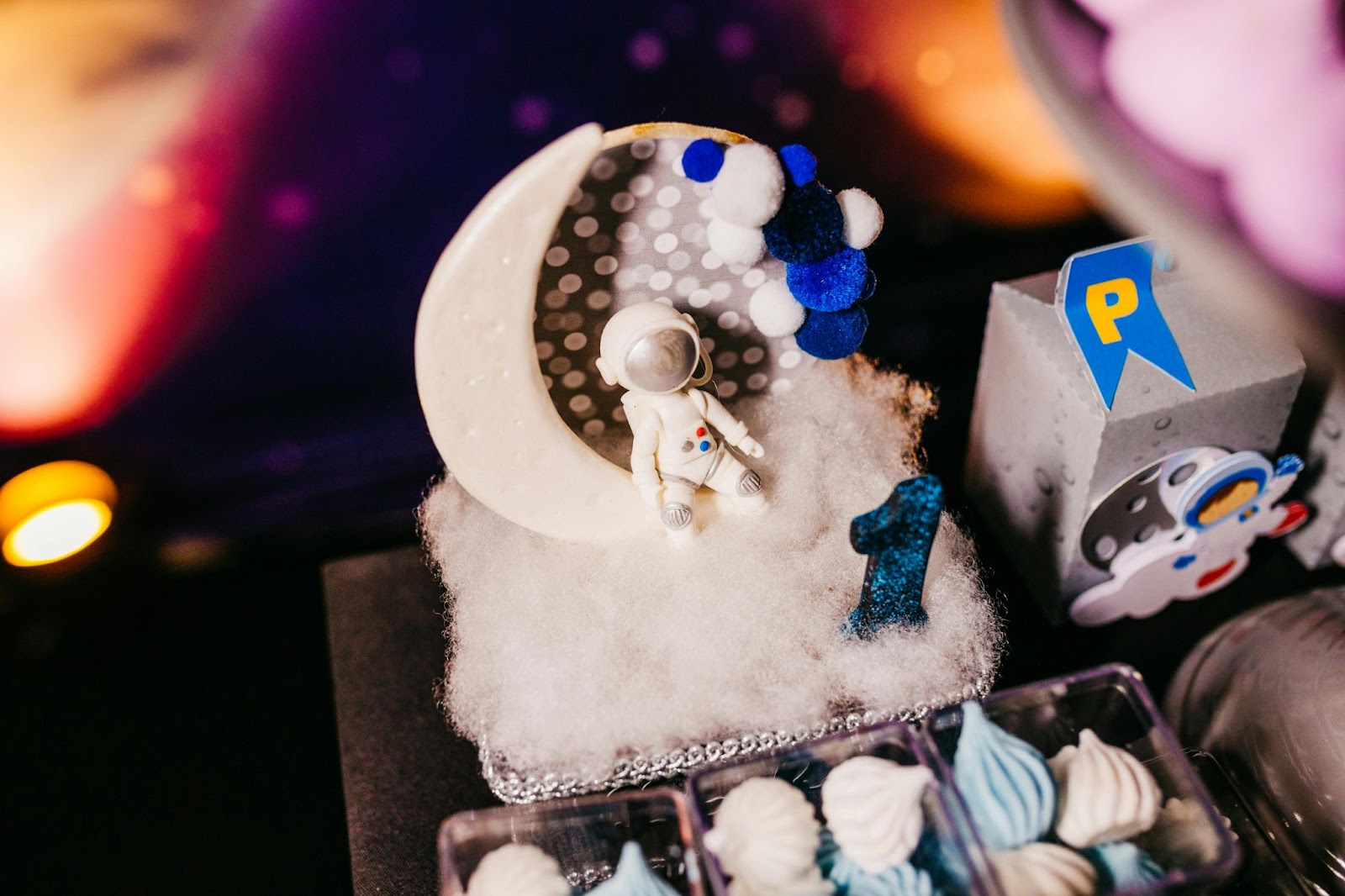 An astronaut sitting on a moon cake.