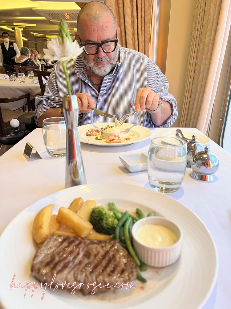 man eating dinner on the aurora ship