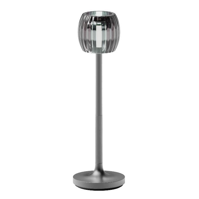 A silver lamp with a round base

Description automatically generated