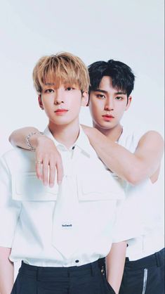 This  contain an image of   Wonwoo's  and Mingyu putting on white shirt and black trouer