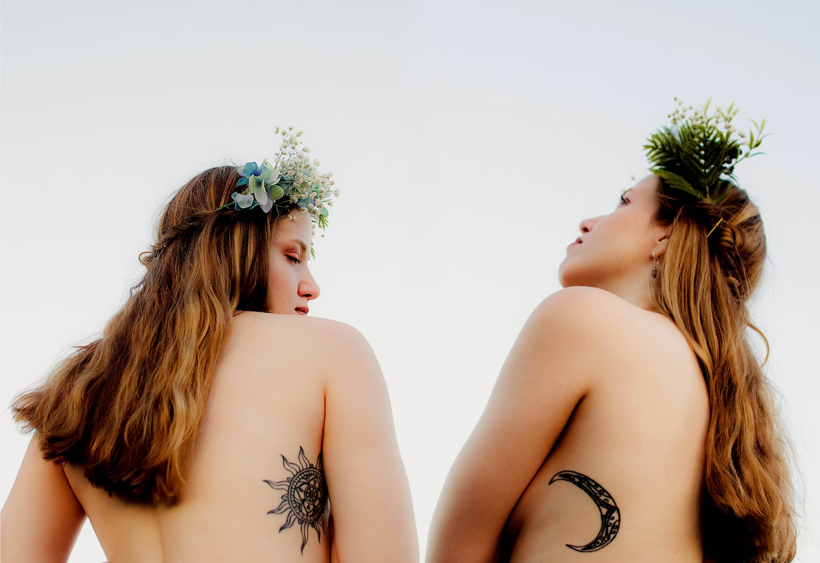 two girls with sun and moon tattoo