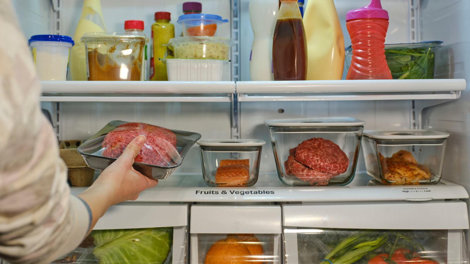 Person packing a refrigerator // Healthier Baby Today