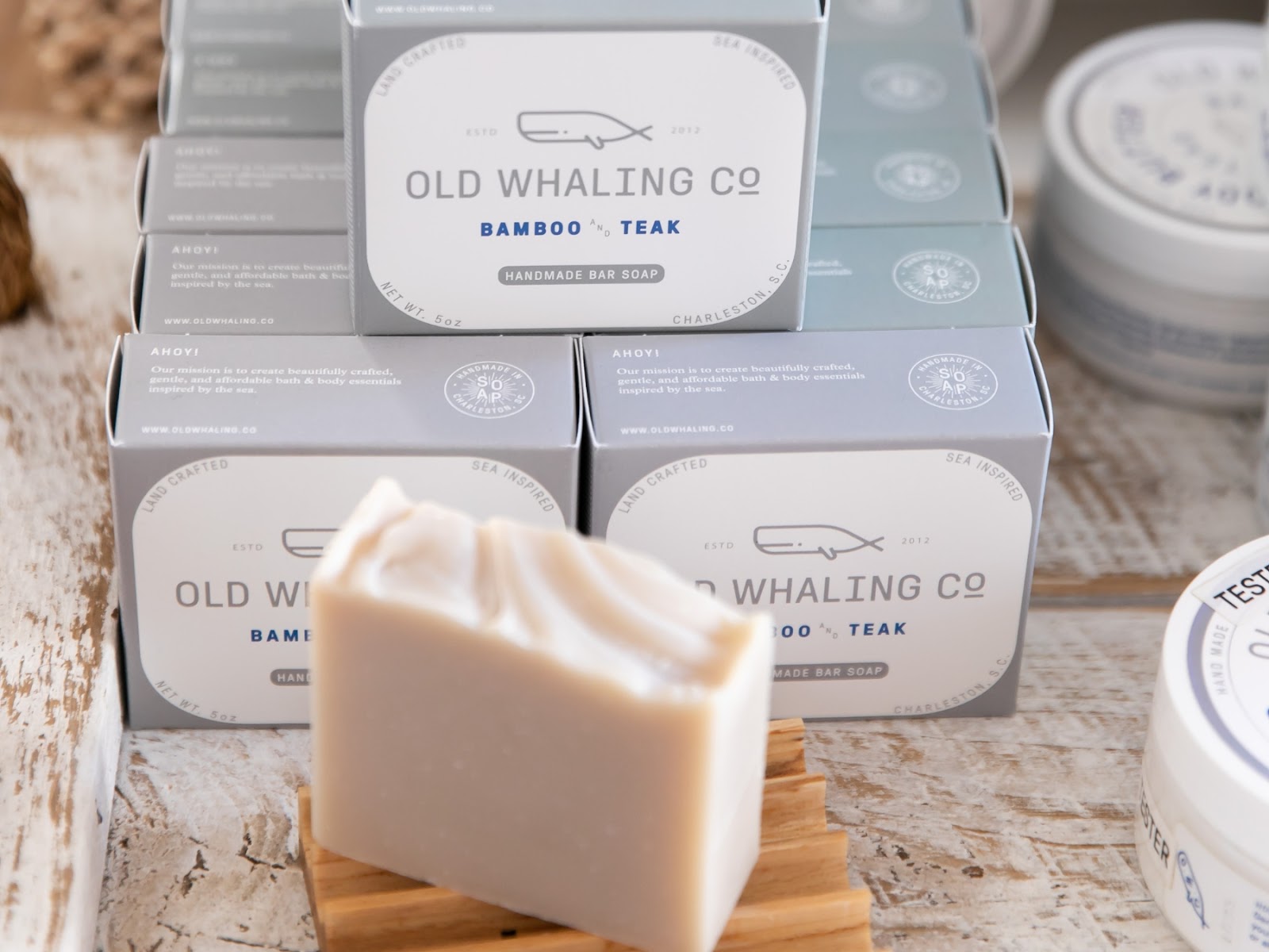 Old Whaling Co. Bamboo & Teak bar soap on soap dish inside retail store on King Street