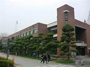 A group of people walking outside of a building

AI-generated content may be incorrect.