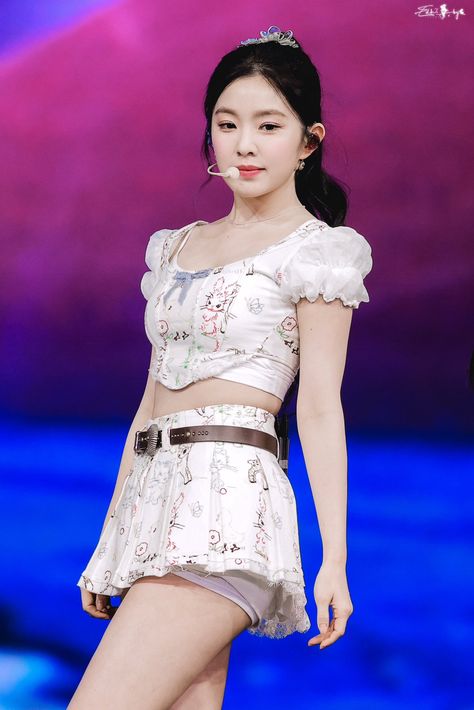 This contain an Irene  in a short skirt and top on the runway