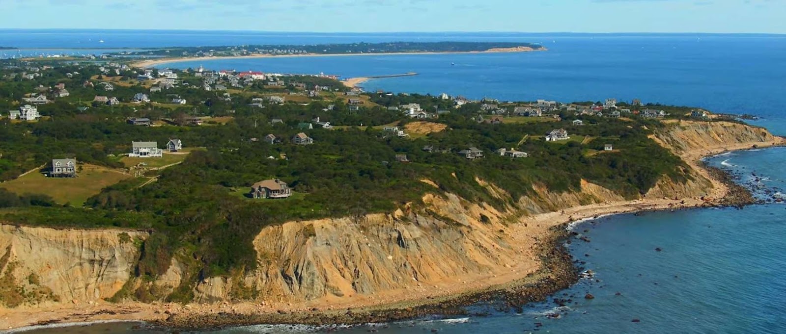 A landscape of a beach and land

AI-generated content may be incorrect.