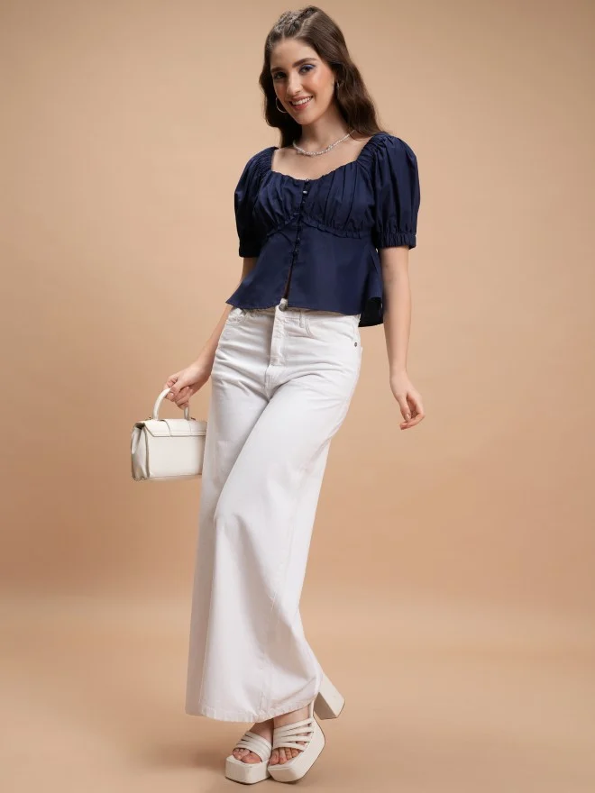 Flared jeans with peplum top